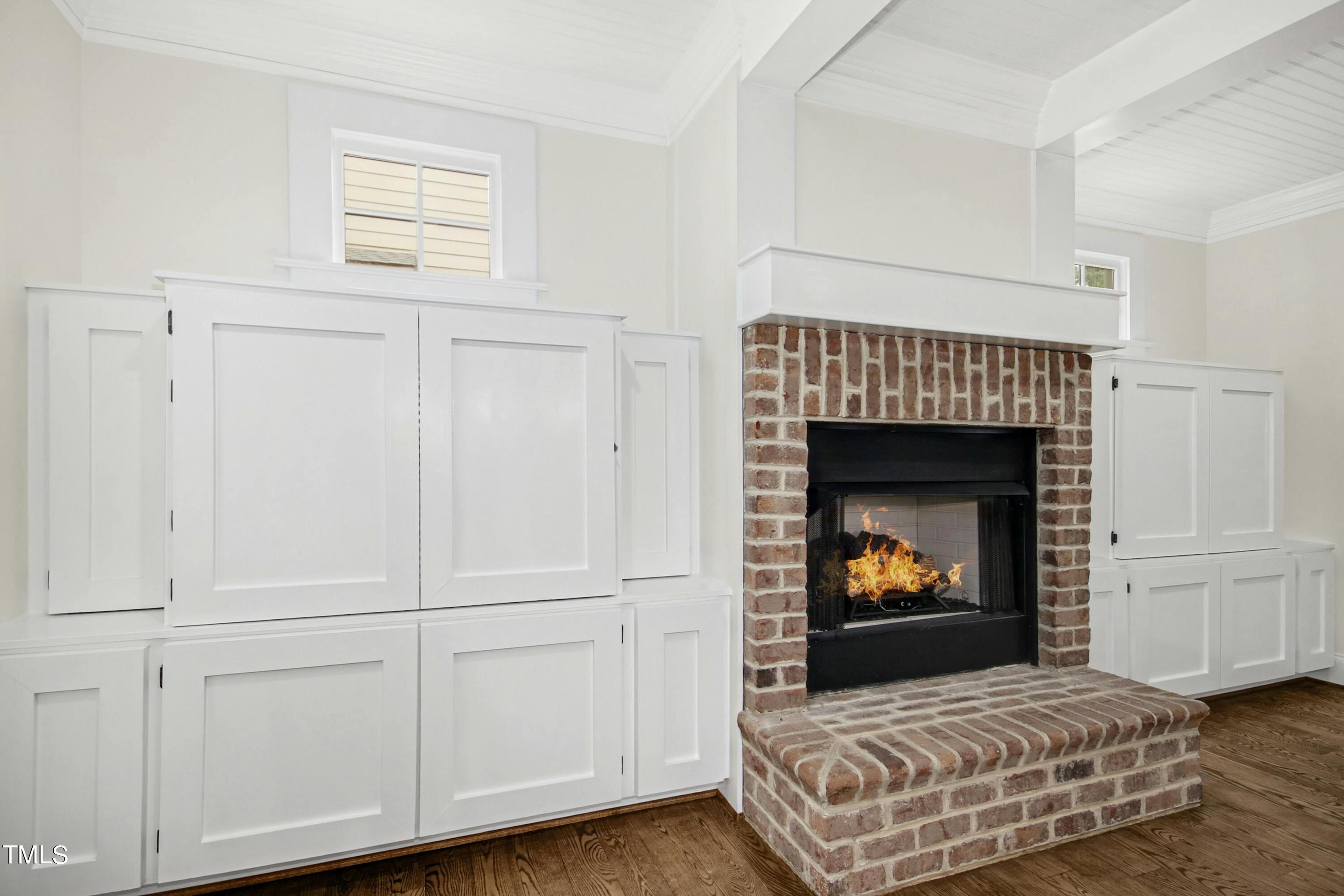 512 Peebles Street Raleigh, NC 27608 - Photo 12 of 45 a living room with furniture and a fireplace