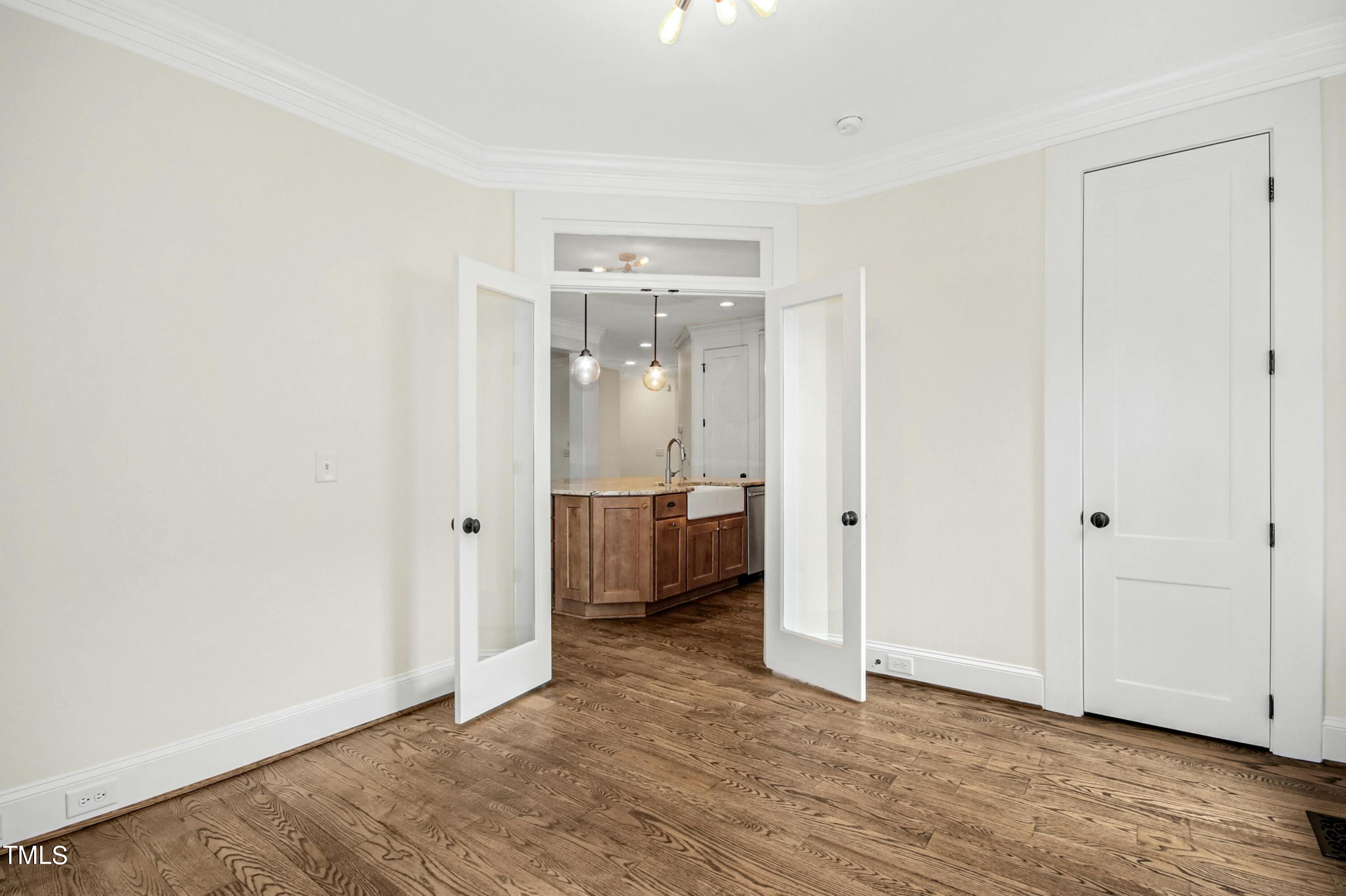 512 Peebles Street Raleigh, NC 27608 - Photo 22 of 45 a view of a room with a gallery and wooden floor