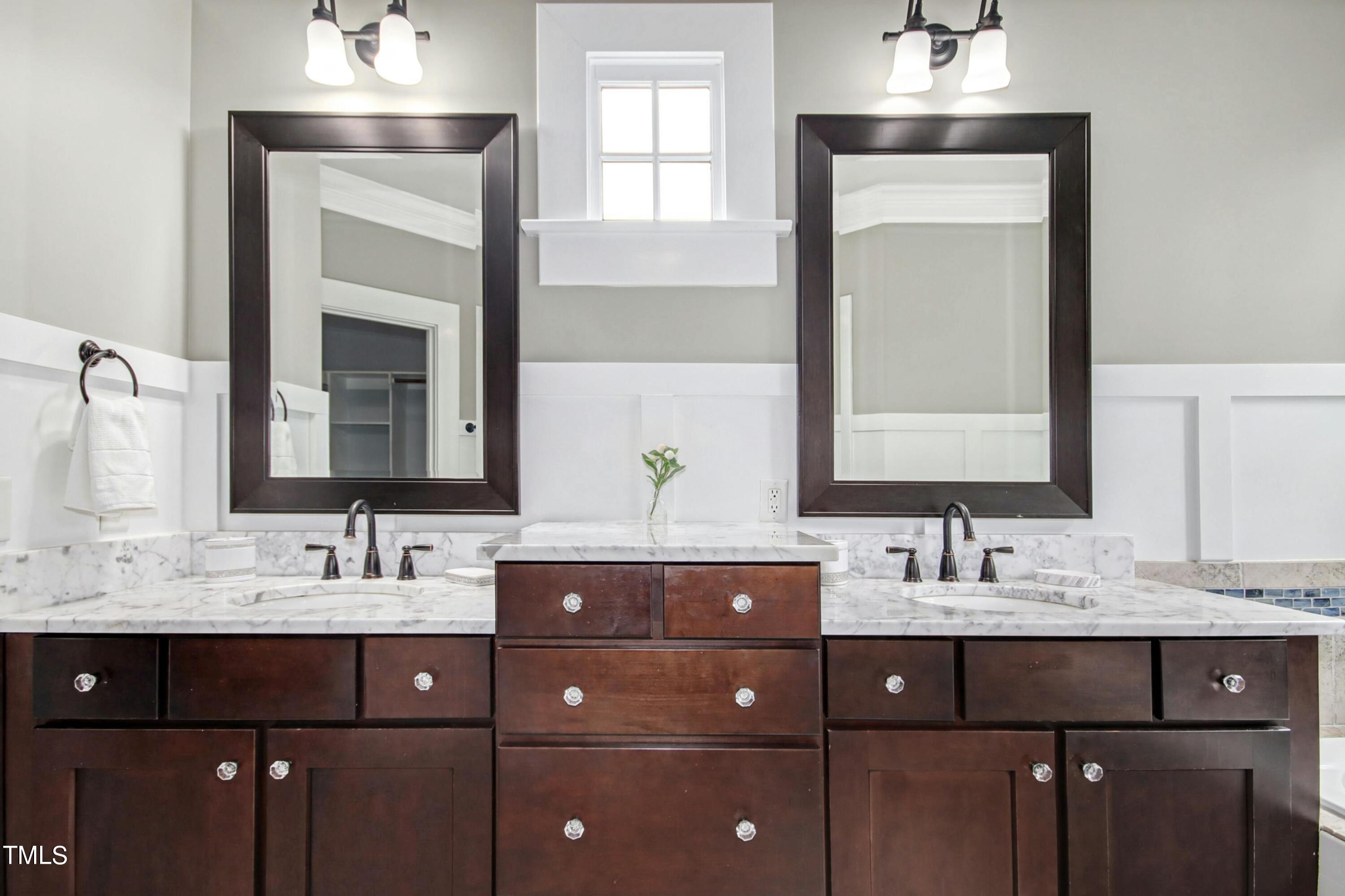 512 Peebles Street Raleigh, NC 27608 - Photo 30 of 45 a bathroom with a sink vanity and a mirror