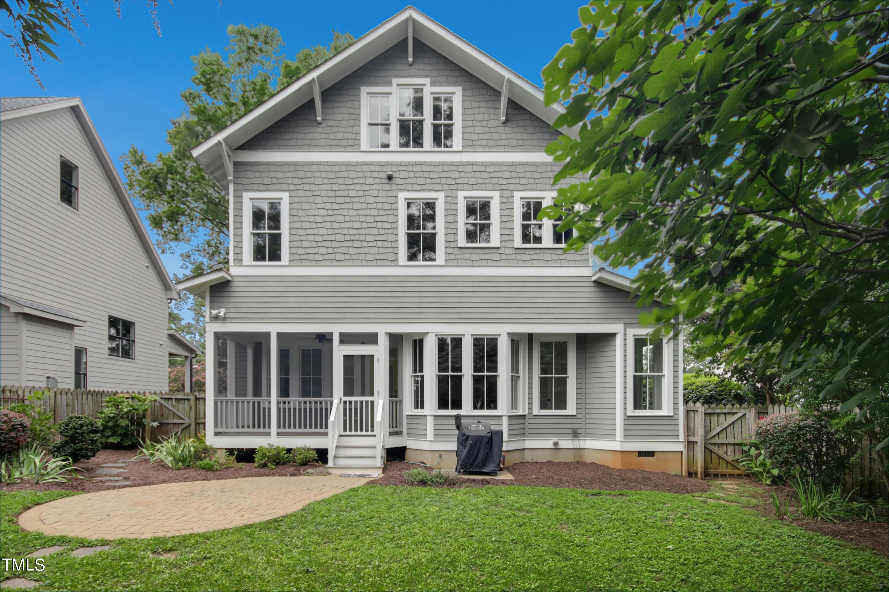 512 Peebles Street Raleigh, NC 27608 - Photo 45 of 45 a front view of a house with a yard and porch