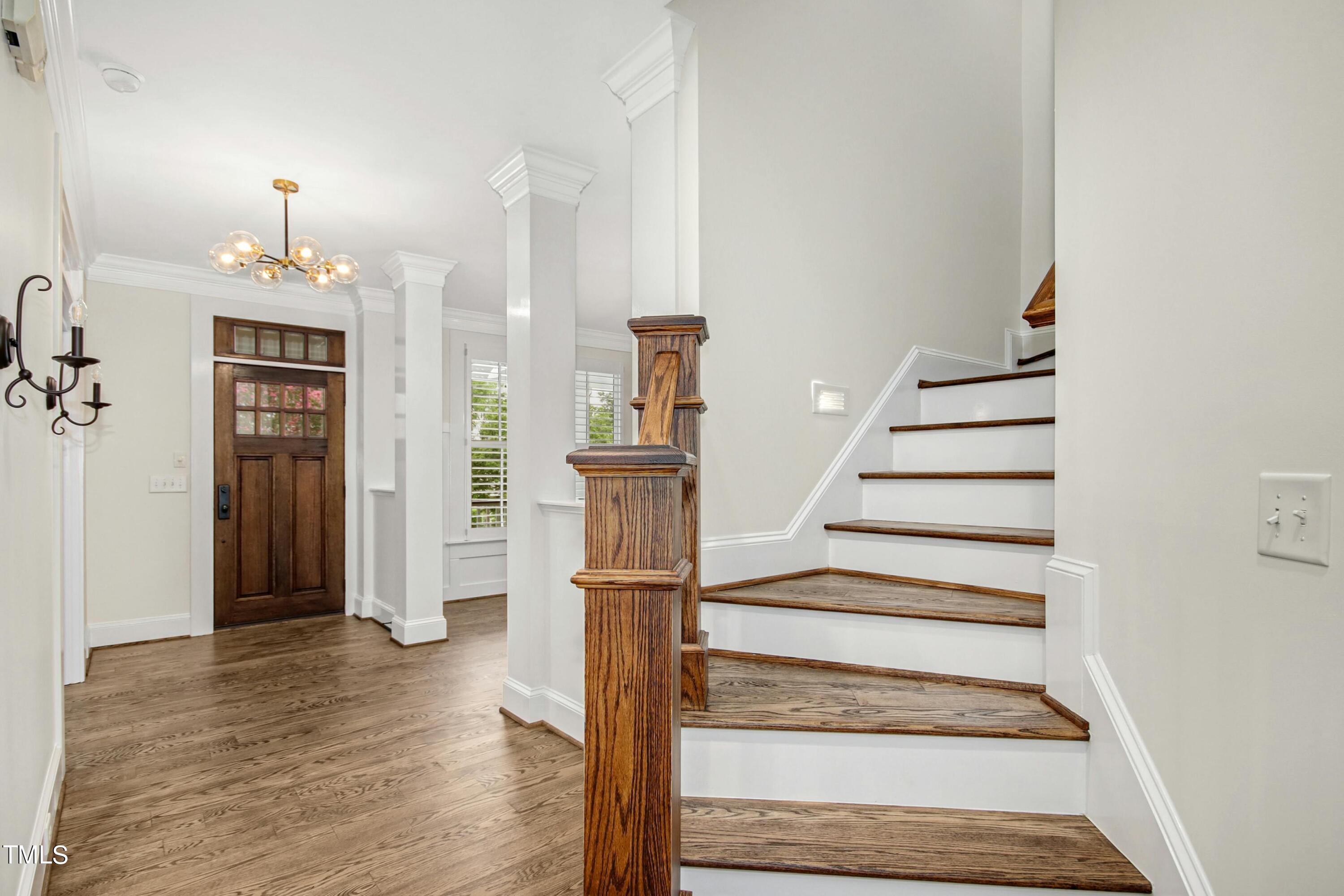 512 Peebles Street Raleigh, NC 27608 - Photo 6 of 45 a view of entryway and hall with wooden floor