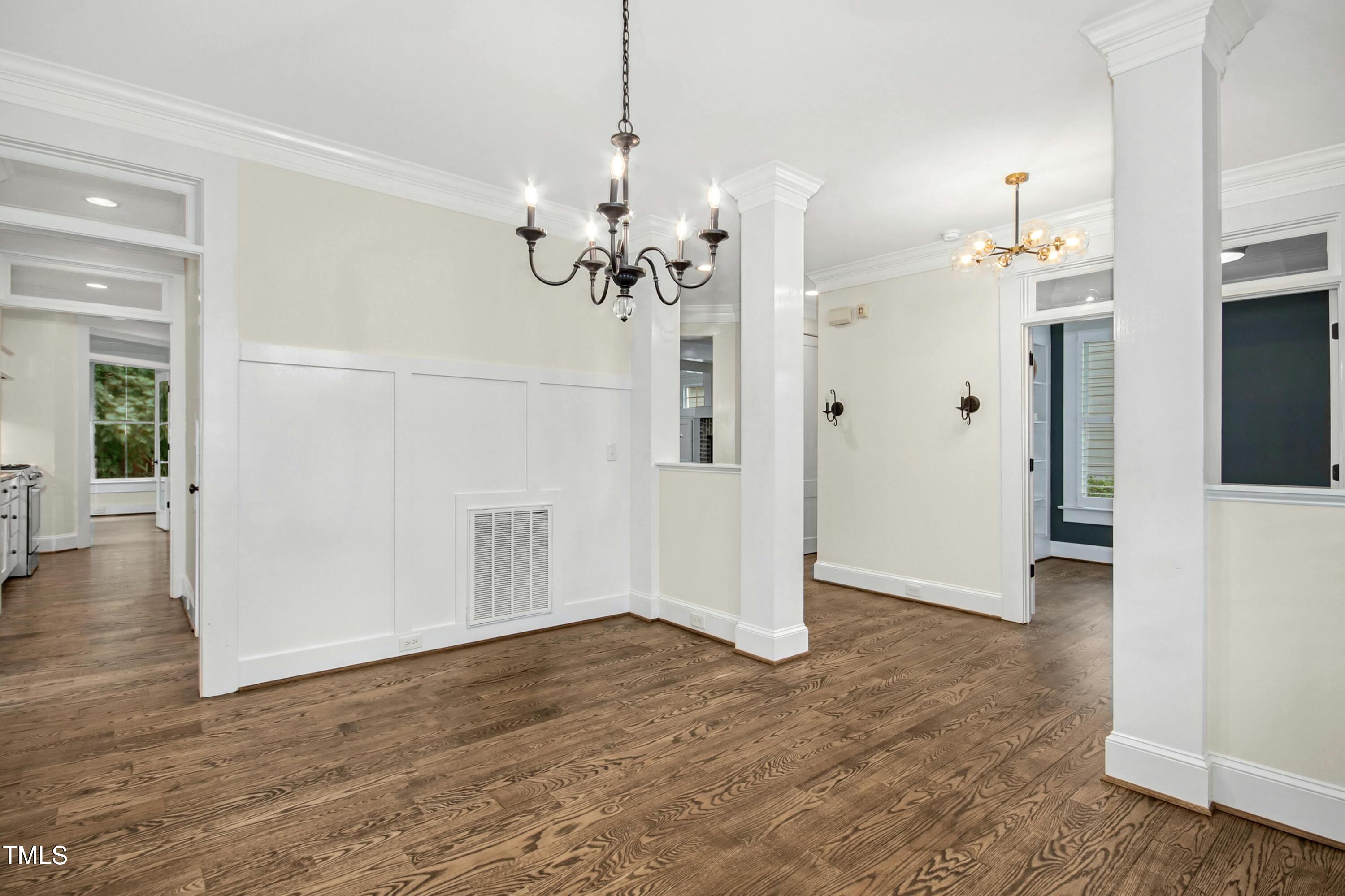 512 Peebles Street Raleigh, NC 27608 - Photo 9 of 45 a view of a chandelier in an empty room