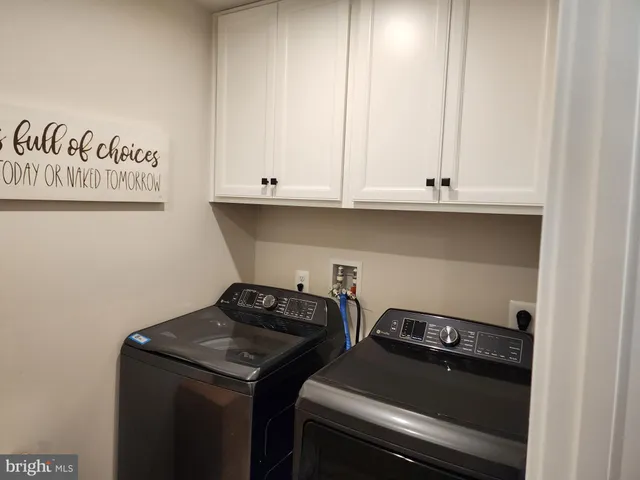 a living room with furniture gym equipment and a large window