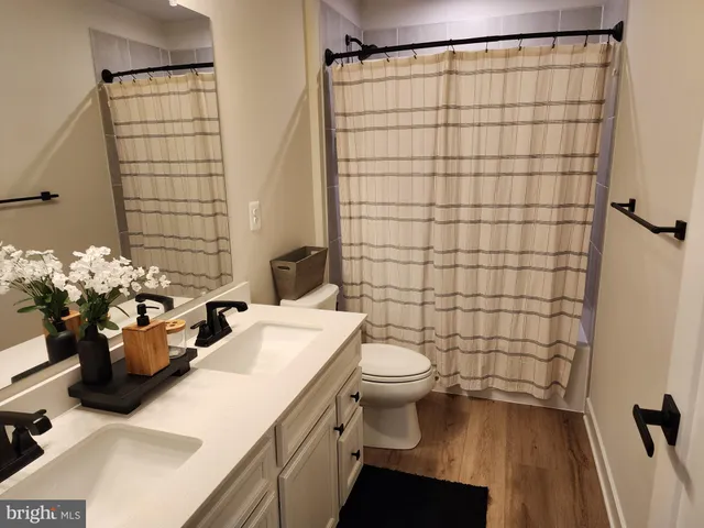 a bedroom with bed and a window