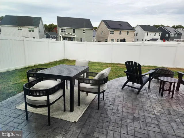 a view of a chairs and table in a kitchen