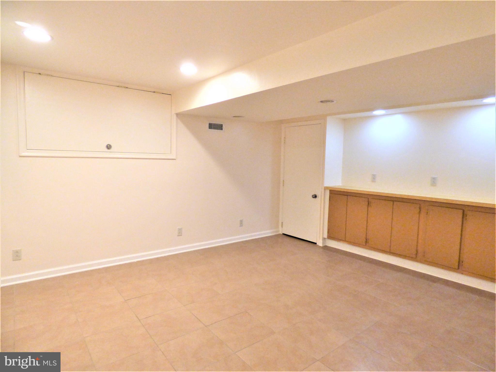 8033 Hammond Road Cheltenham, PA 19012 - Photo 25 of 38 Finished Basement - Tile Floor, Built-In Cabinets