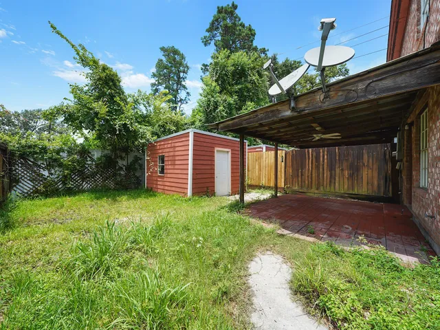 a backyard of a house with lots of green space