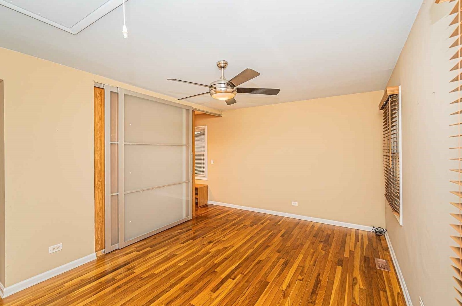 1345 Hassell Drive Hoffman Estates, IL 60169 - Photo 14 of 36 a view of a room with wooden floor