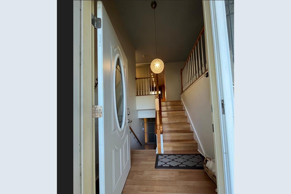 1345 Hassell Drive Hoffman Estates, IL 60169 - Photo 2 of 36 a view of entryway and hall with wooden floor