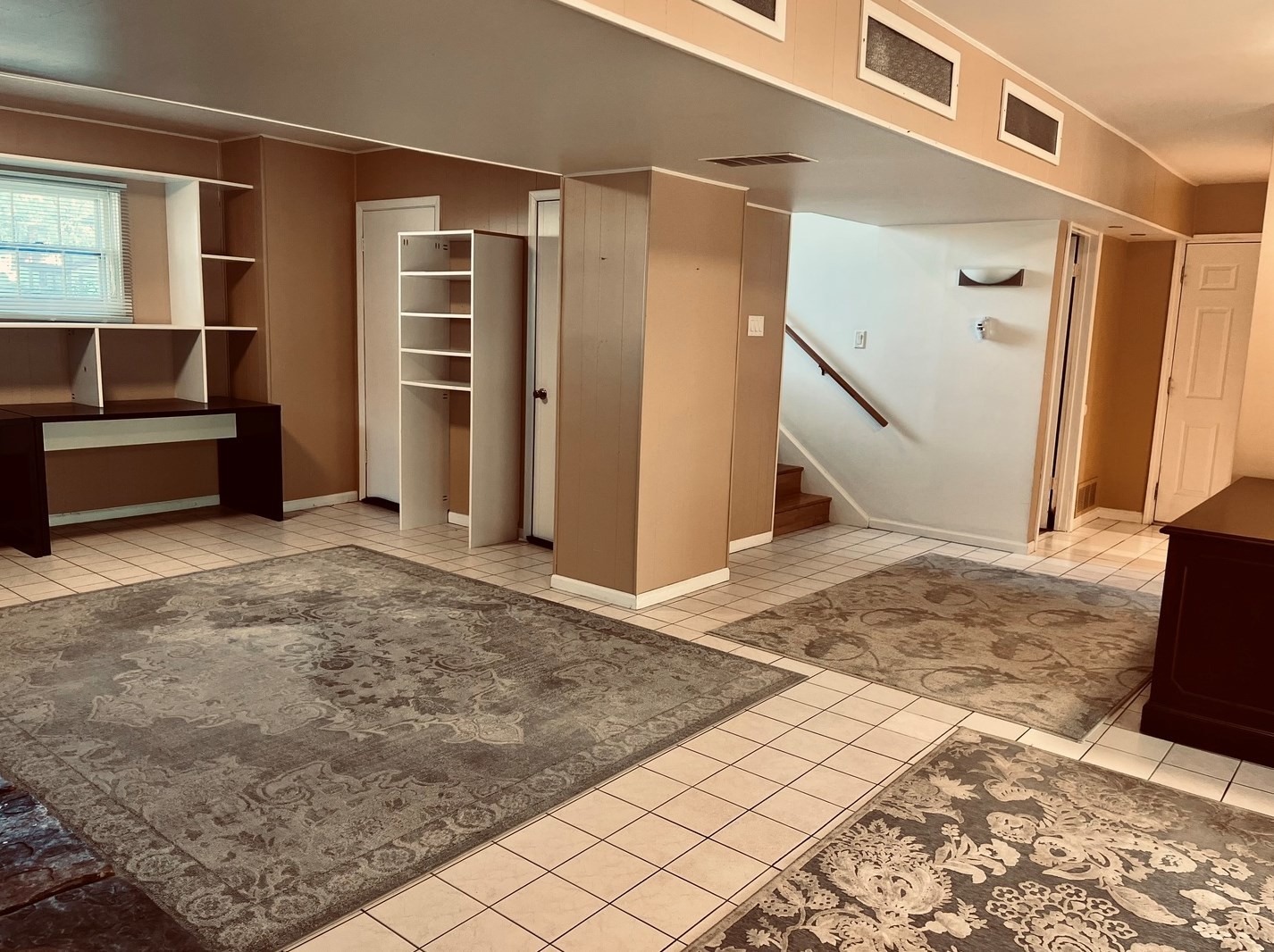 1345 Hassell Drive Hoffman Estates, IL 60169 - Photo 21 of 36 a view of a livingroom with kitchen and staircase