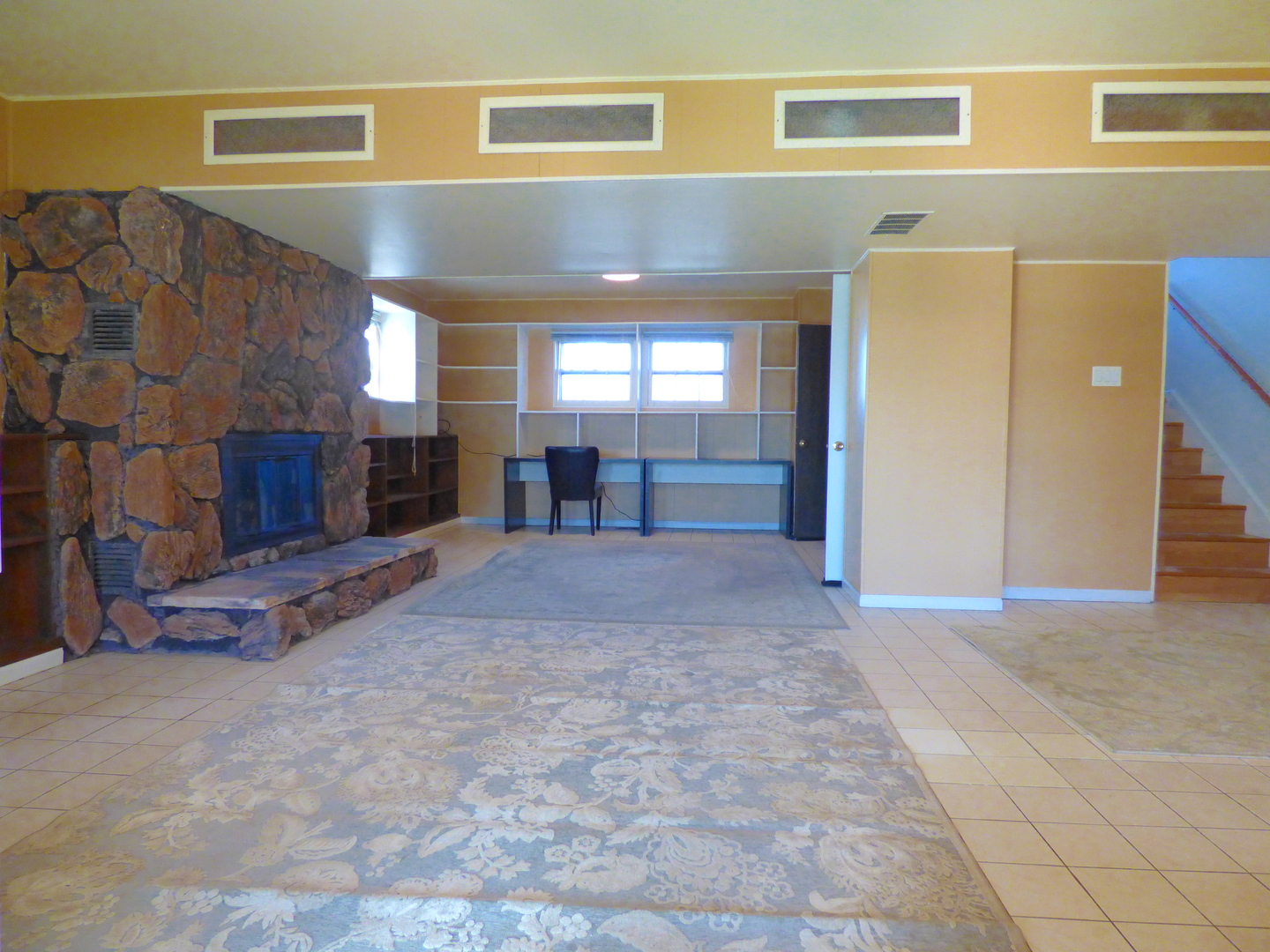 1345 Hassell Drive Hoffman Estates, IL 60169 - Photo 22 of 36 a view of a livingroom with a fireplace