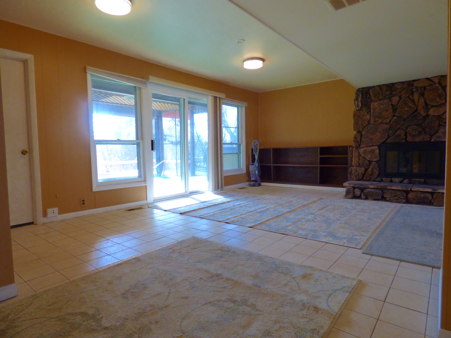 1345 Hassell Drive Hoffman Estates, IL 60169 - Photo 23 of 36 a living room with furniture a flat screen tv and a fireplace