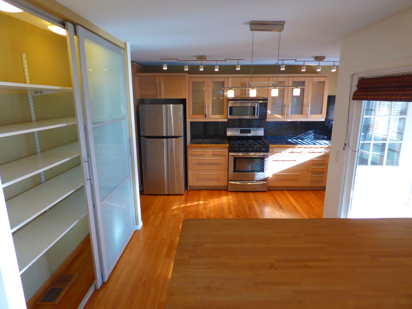 1345 Hassell Drive Hoffman Estates, IL 60169 - Photo 5 of 36 a kitchen with stainless steel appliances granite countertop a refrigerator