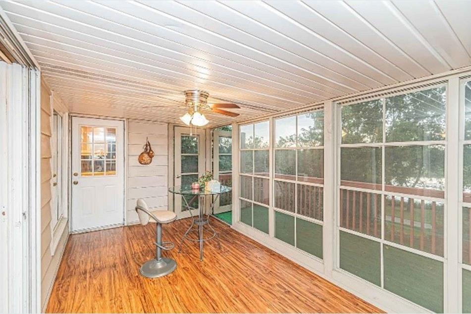1345 Hassell Drive Hoffman Estates, IL 60169 - Photo 6 of 36 a room with wooden floor and a large window