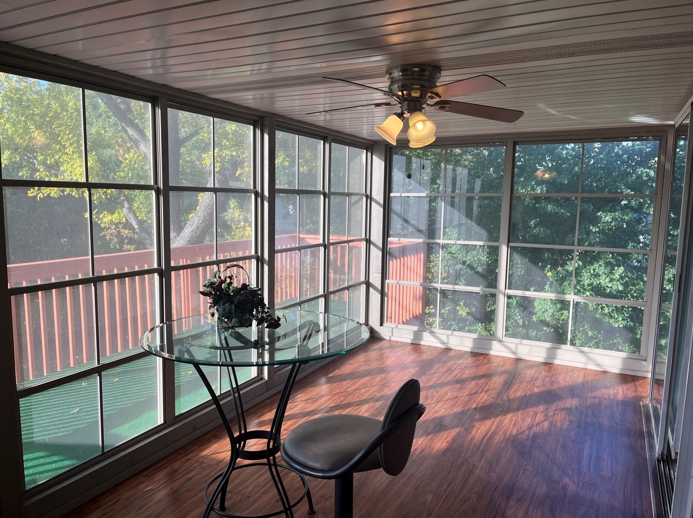1345 Hassell Drive Hoffman Estates, IL 60169 - Photo 7 of 36 a view of a porch with furniture and wooden floor