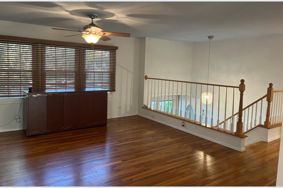 1345 Hassell Drive Hoffman Estates, IL 60169 - Photo 8 of 36 a view of a livingroom with wooden floor