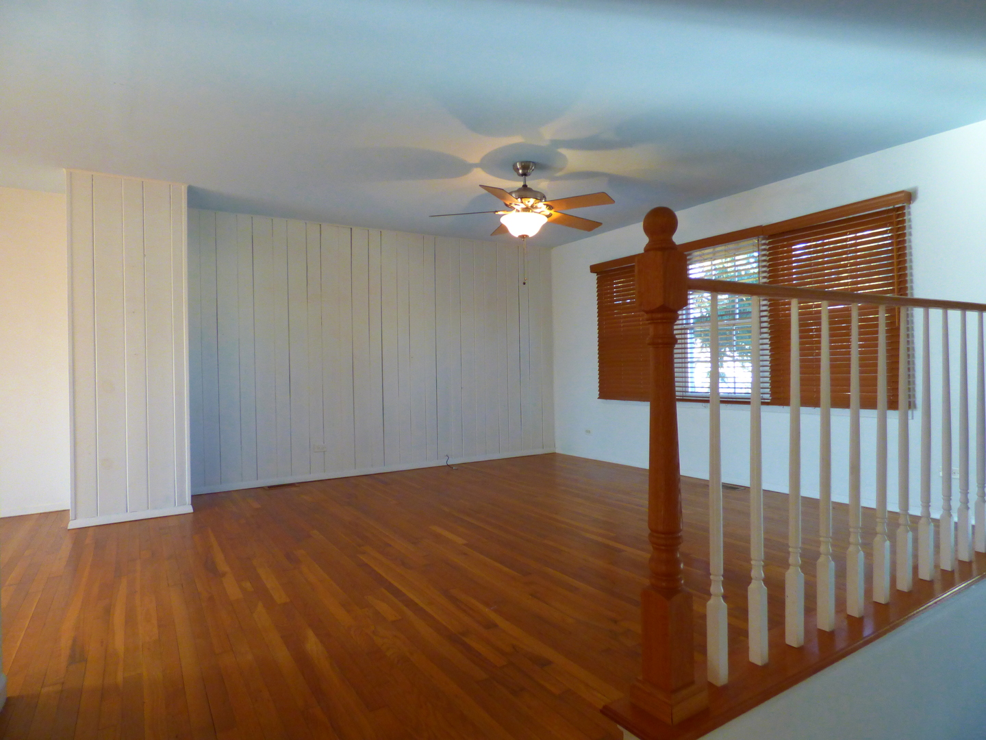 1345 Hassell Drive Hoffman Estates, IL 60169 - Photo 9 of 36 a view of livingroom with hardwood floor and ceiling fan