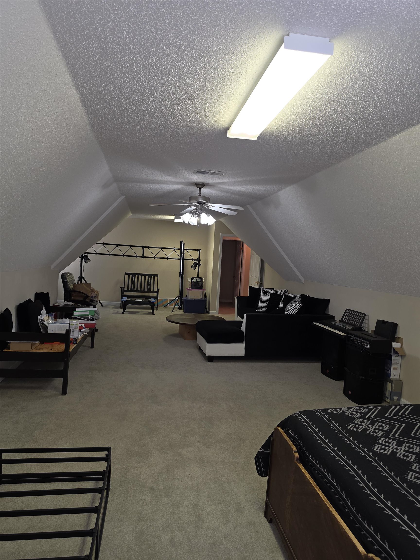 7253 Rourke Circle Memphis, TN 38125 - Photo 24 of 31 Spacious bonus room featuring sloped ceilings, textured ceiling finish, recessed lighting, ceiling fan light fixture, and neutral carpeting