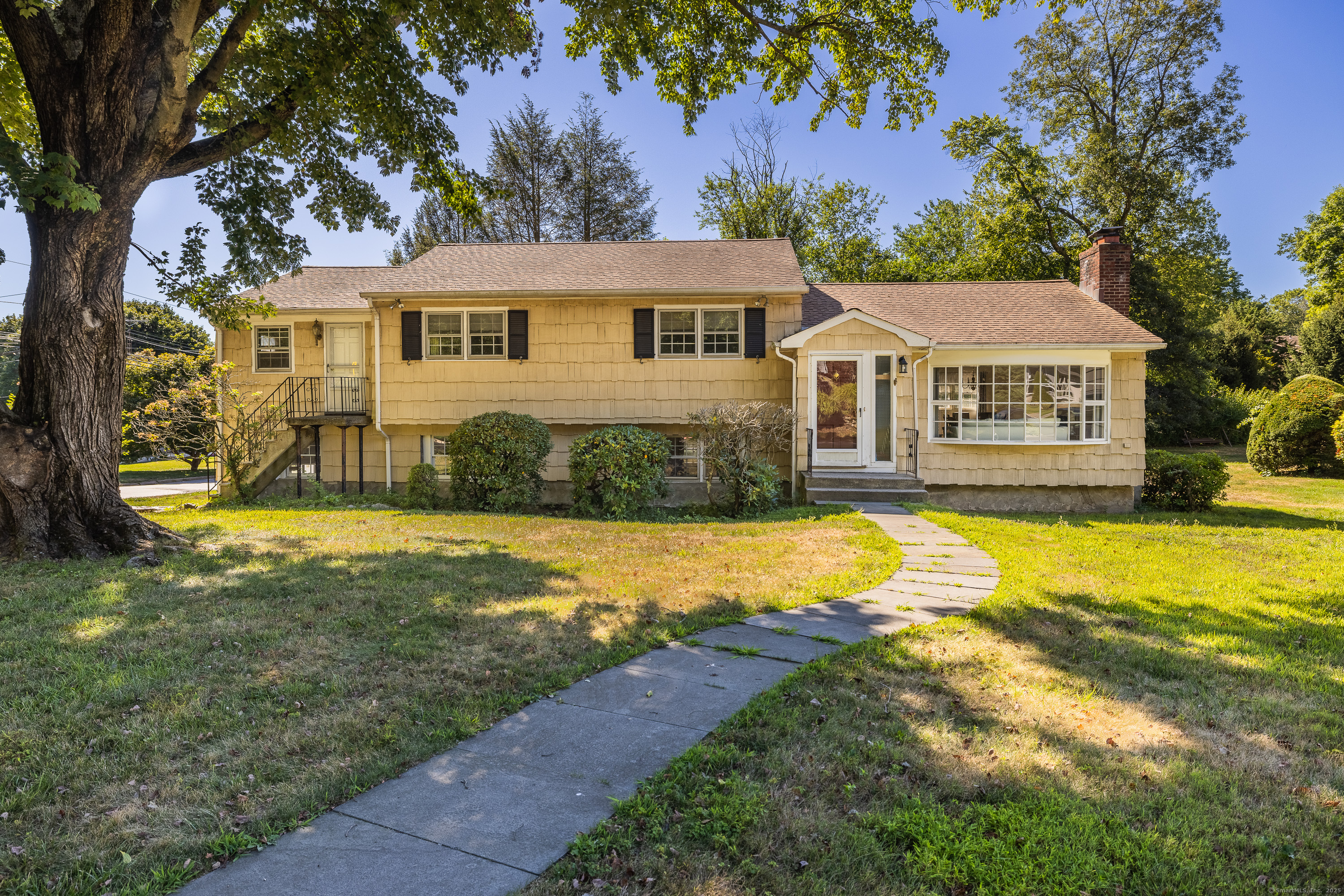 5 Random Road Fairfield, CT 06825 - Photo 1 of 1 a front view of a house with swimming pool