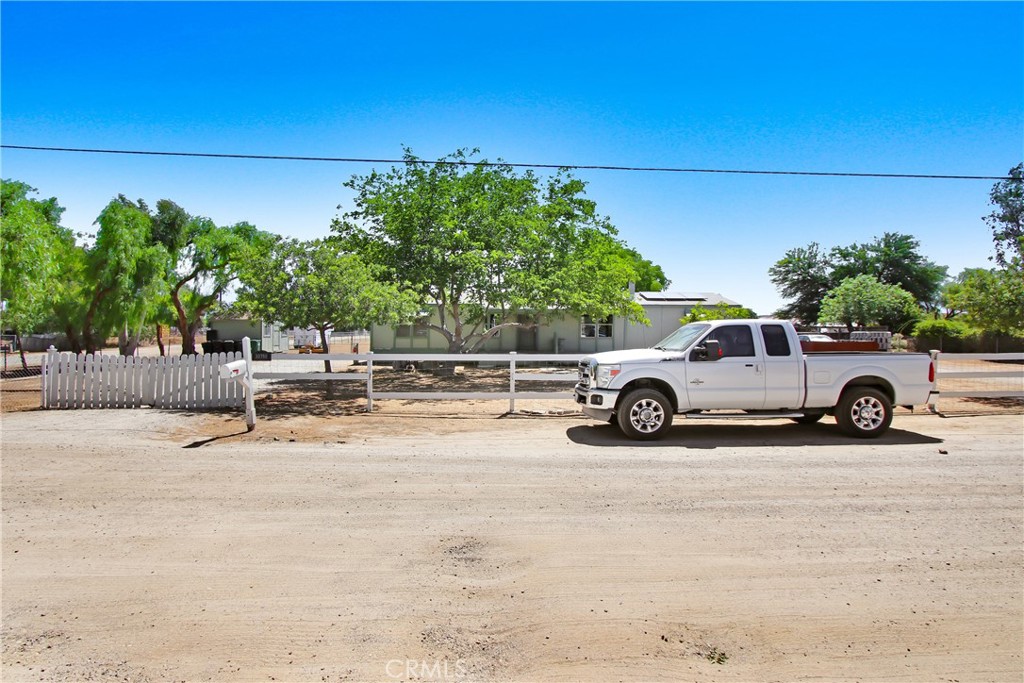30750 Old Windmill Road Menifee, CA 92584 - Photo 3 of 17 a view of a car parked in front of a house