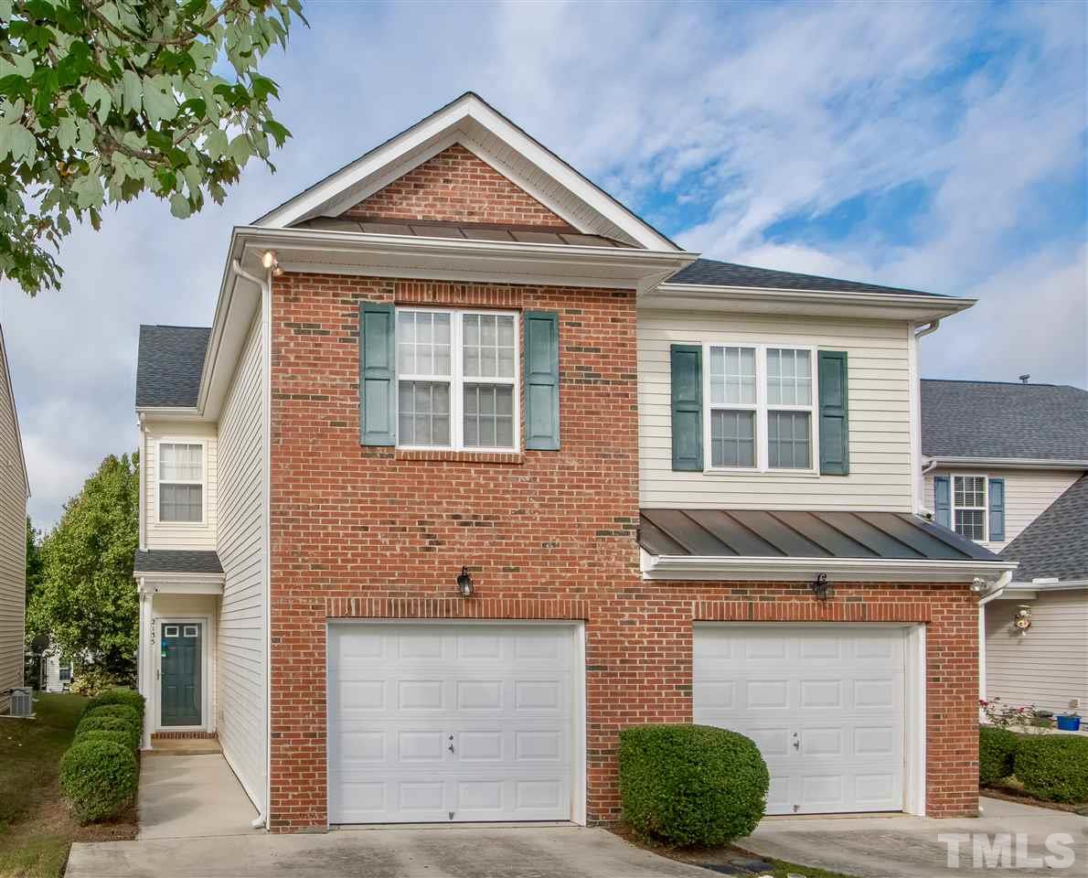 2135 Metacomet Way Raleigh, NC 27604 - Photo 1 of 25 a front view of a house with a yard and garage