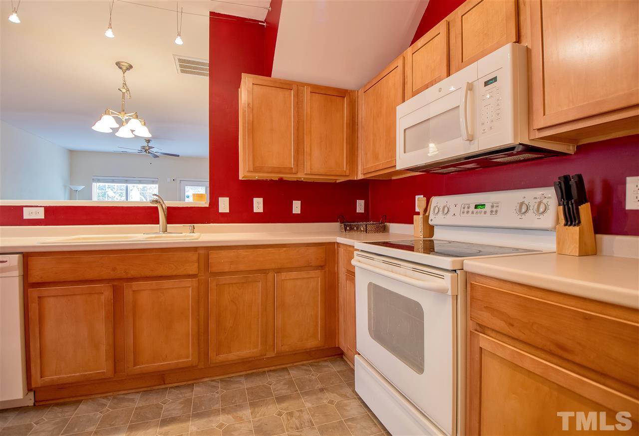2135 Metacomet Way Raleigh, NC 27604 - Photo 12 of 25 a kitchen with a sink cabinets and appliances
