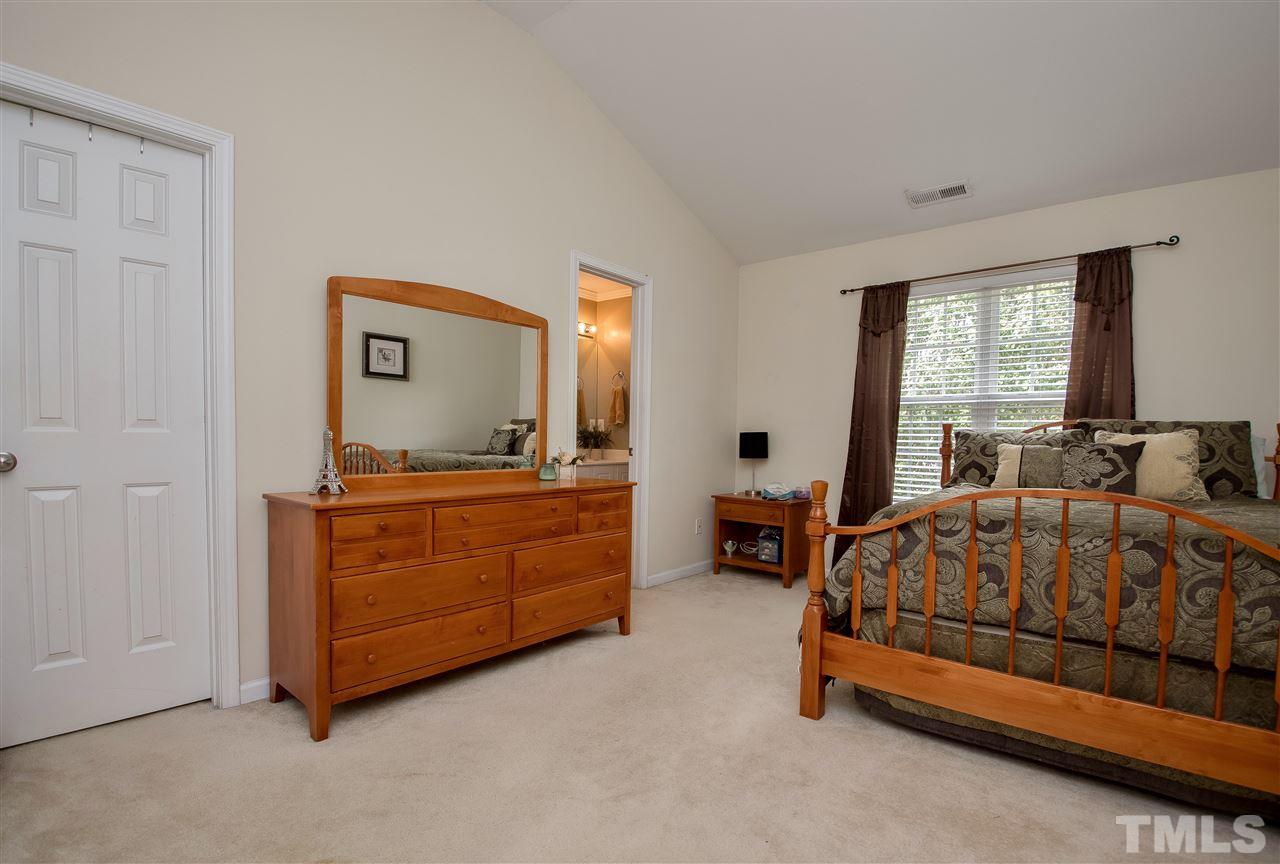 2135 Metacomet Way Raleigh, NC 27604 - Photo 14 of 25 a bed room with furniture and a window