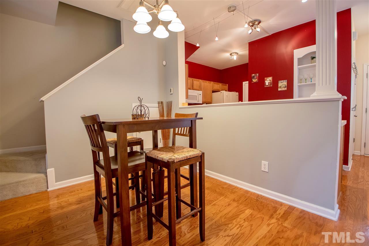 2135 Metacomet Way Raleigh, NC 27604 - Photo 2 of 25 a view of a dining room with furniture and a chandelier