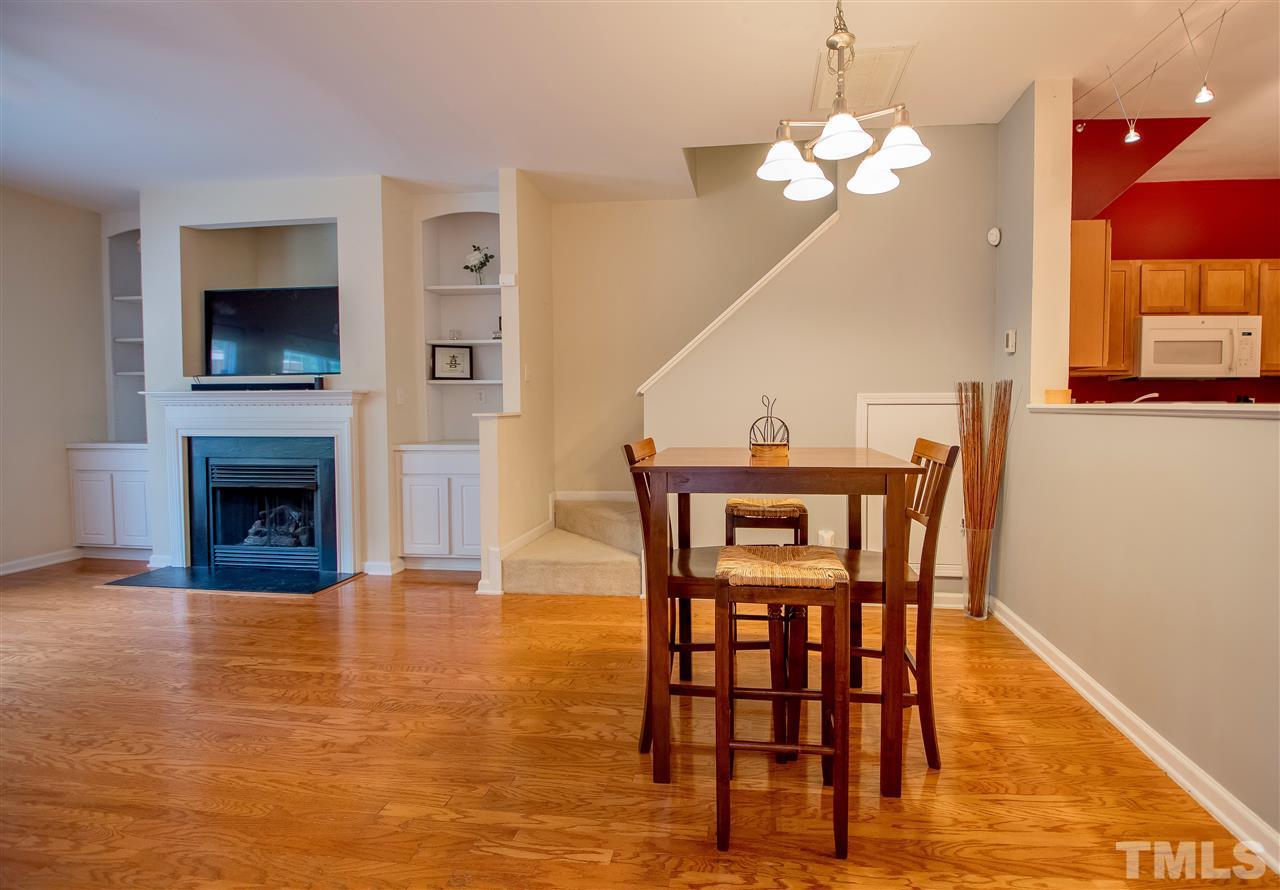 2135 Metacomet Way Raleigh, NC 27604 - Photo 3 of 25 a view of a dining room with furniture and wooden floor