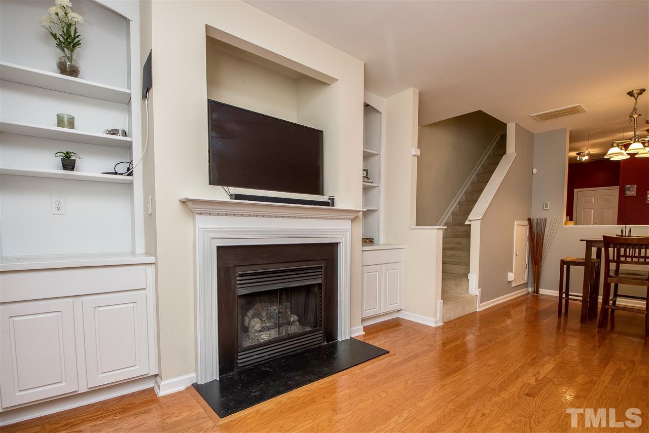2135 Metacomet Way Raleigh, NC 27604 - Photo 6 of 25 a living room with furniture fireplace and flat screen tv