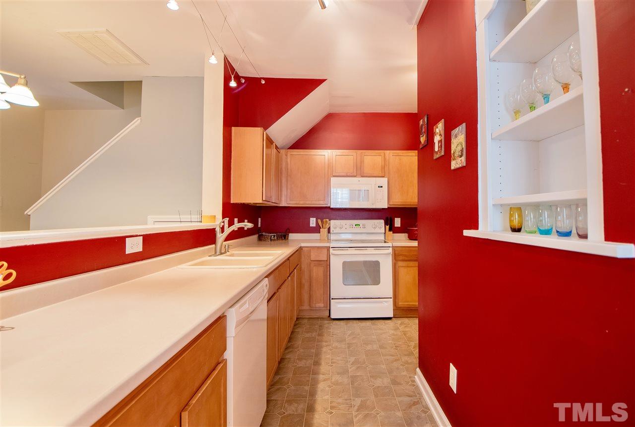 2135 Metacomet Way Raleigh, NC 27604 - Photo 10 of 25 a kitchen with a stove and a sink