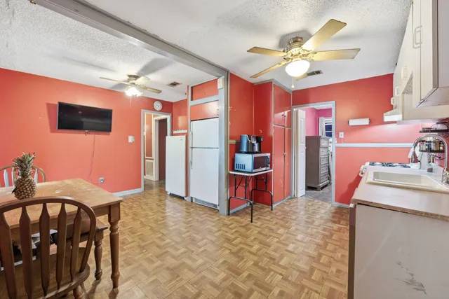a kitchen with a refrigerator sink and microwave