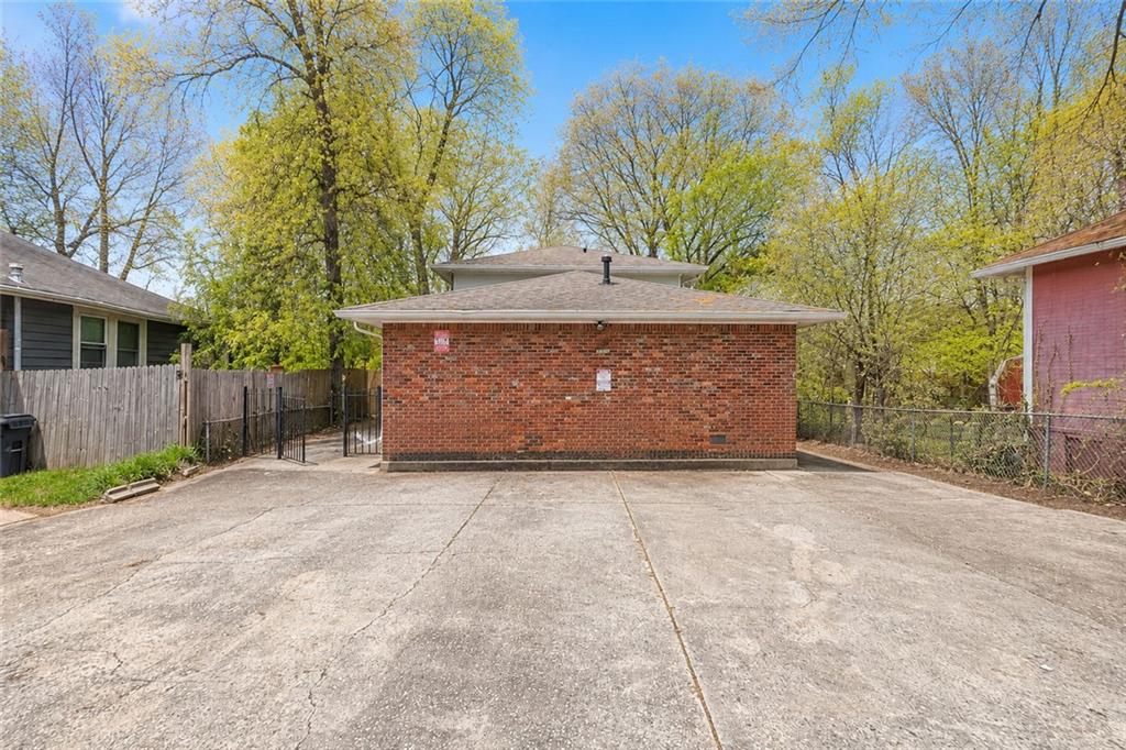 3203 East Point Street, Unit 4 Atlanta, GA 30344 - Photo 17 of 18 a view of backyard with a barn and a large cactus tree