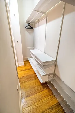 a bathroom with a sink a mirror and a bathtub