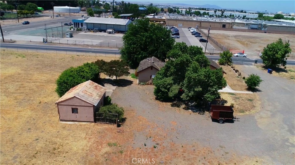 140 Swanson Road Manteca, CA 95337 - Photo 4 of 14 an aerial view of a house with a yard and a large tree
