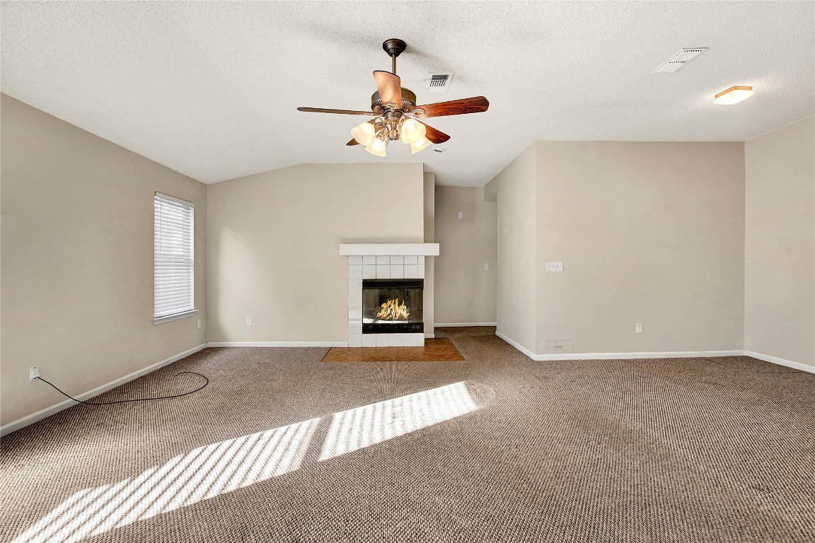 909 Gavagan Road Jacksonville, FL 32233 - Photo 13 of 17 a view of an empty room with a fireplace