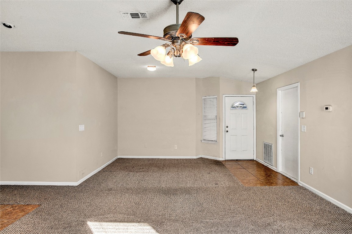 909 Gavagan Road Jacksonville, FL 32233 - Photo 14 of 17 wooden floor in an empty room and a chandelier fan