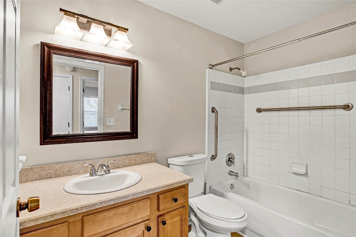 909 Gavagan Road Jacksonville, FL 32233 - Photo 9 of 17 a bathroom with a sink a toilet and shower