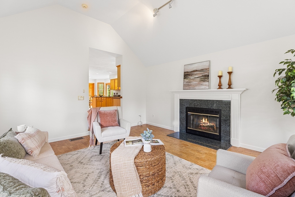 3 Wildflower Drive Sutton, MA 01590 - Photo 11 of 31 a living room with furniture and a fireplace