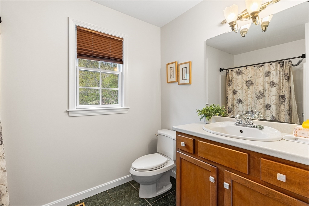 3 Wildflower Drive Sutton, MA 01590 - Photo 18 of 31 a bathroom with a sink toilet and window