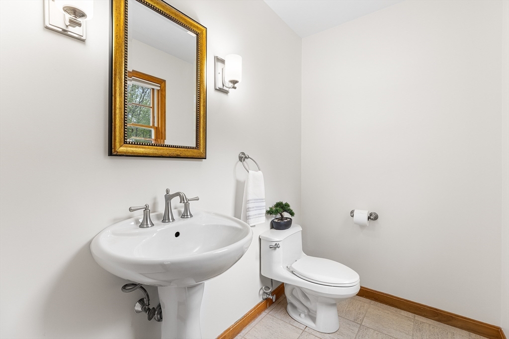 3 Wildflower Drive Sutton, MA 01590 - Photo 20 of 31 a bathroom with a toilet sink and mirror