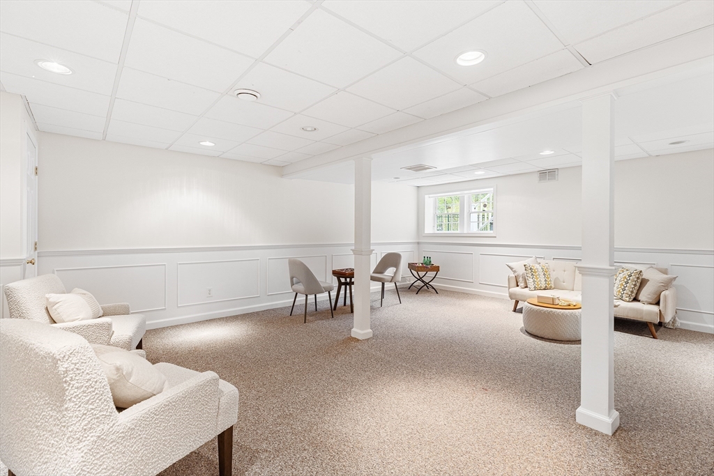 3 Wildflower Drive Sutton, MA 01590 - Photo 22 of 31 a living room with furniture and a table