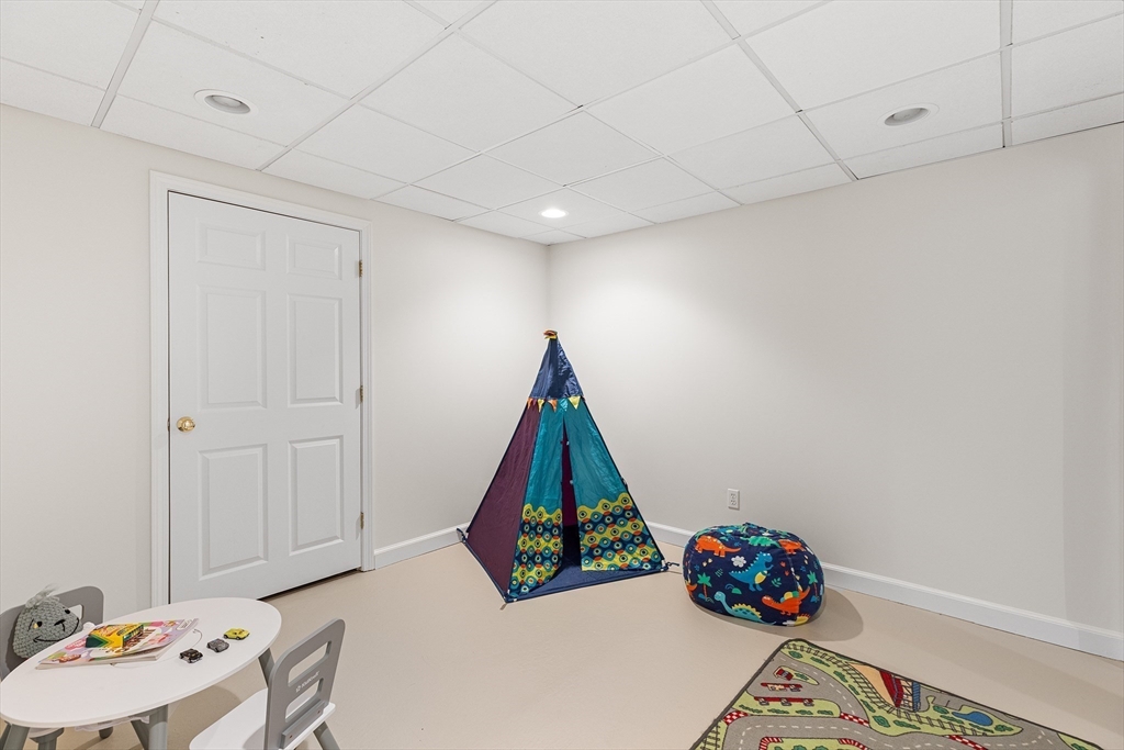 3 Wildflower Drive Sutton, MA 01590 - Photo 25 of 31 a room with toys and wooden floor