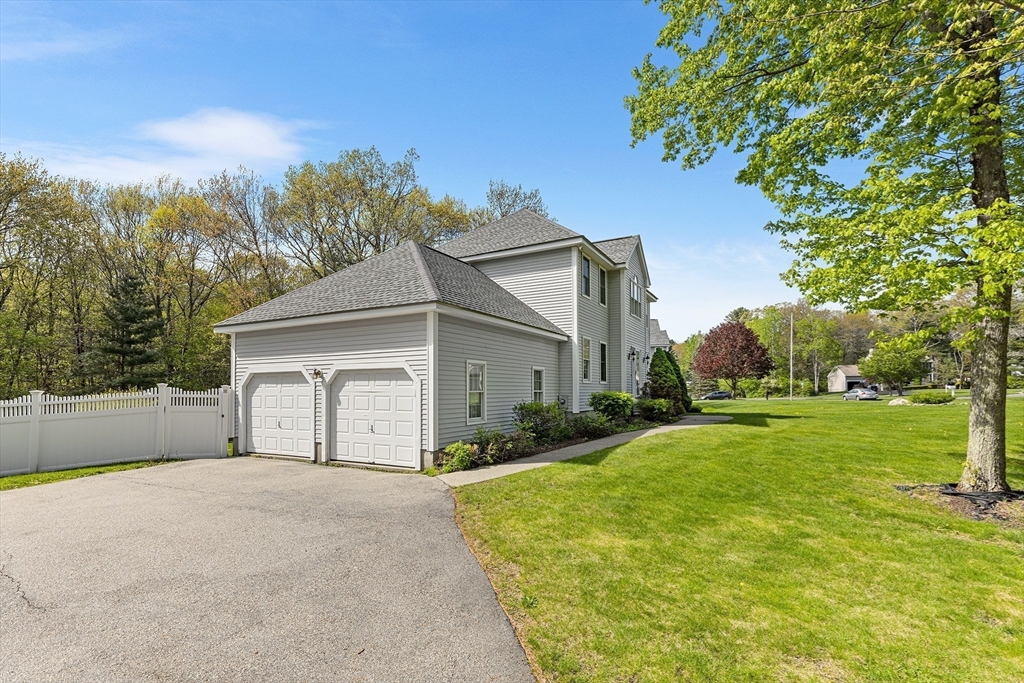 3 Wildflower Drive Sutton, MA 01590 - Photo 28 of 31 a front view of a house with a yard and garage