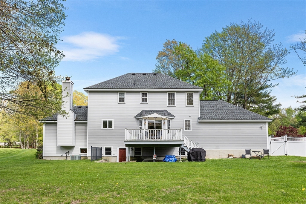 3 Wildflower Drive Sutton, MA 01590 - Photo 29 of 31 a view of a white house with a big yard and large trees