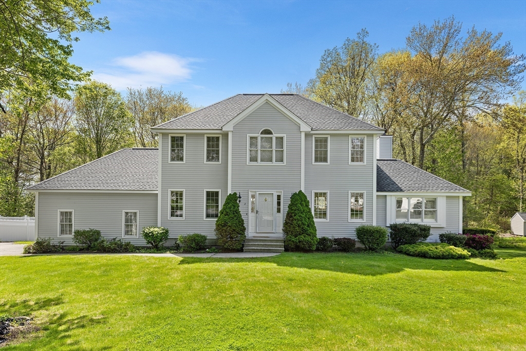 3 Wildflower Drive Sutton, MA 01590 - Photo 3 of 31 a front view of a house with a garden