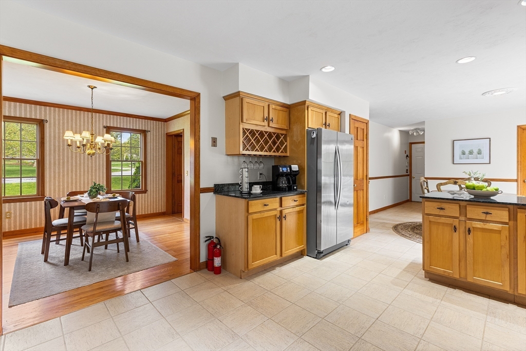 3 Wildflower Drive Sutton, MA 01590 - Photo 7 of 31 a kitchen with granite countertop refrigerator and furniture