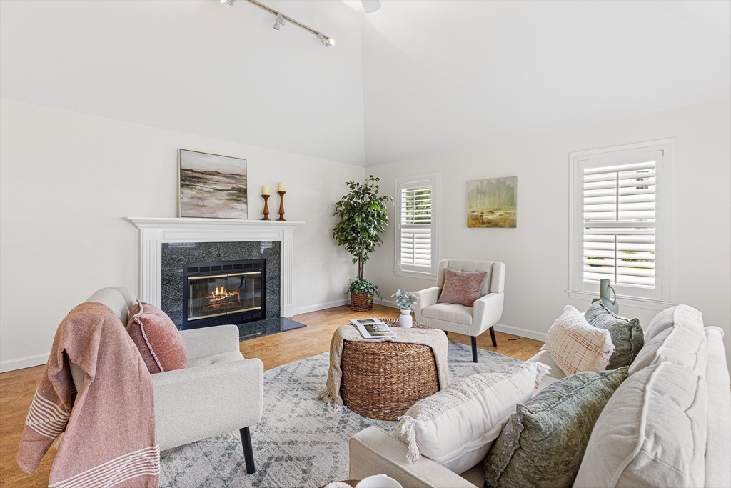 3 Wildflower Drive Sutton, MA 01590 - Photo 10 of 31 a living room with furniture and a fireplace