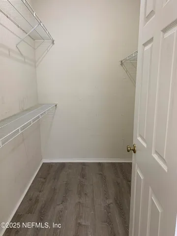 a view of a room with racks on the wall