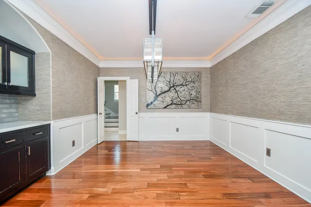 a view of a kitchen cabinets and wooden floor